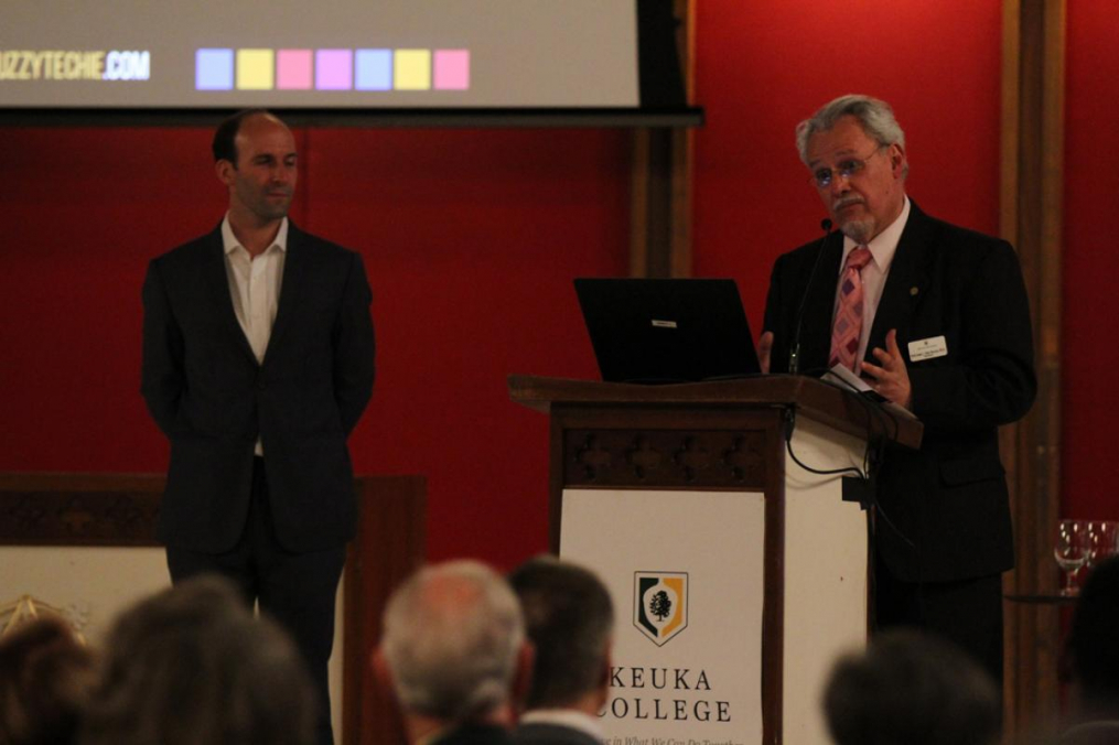 College President Dr. Jorge L. Díaz-Herrera shares the stage with guest speaker Scott Hartley.