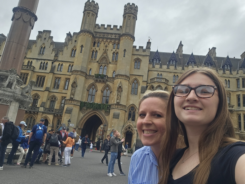 Kaylee Hodges poses with her host mother in front of cathedral