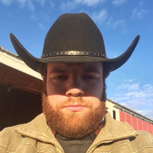 Bryce Bush wearing a cowboy hat during his Keuka College Field Period at a Colorado horse ranch.